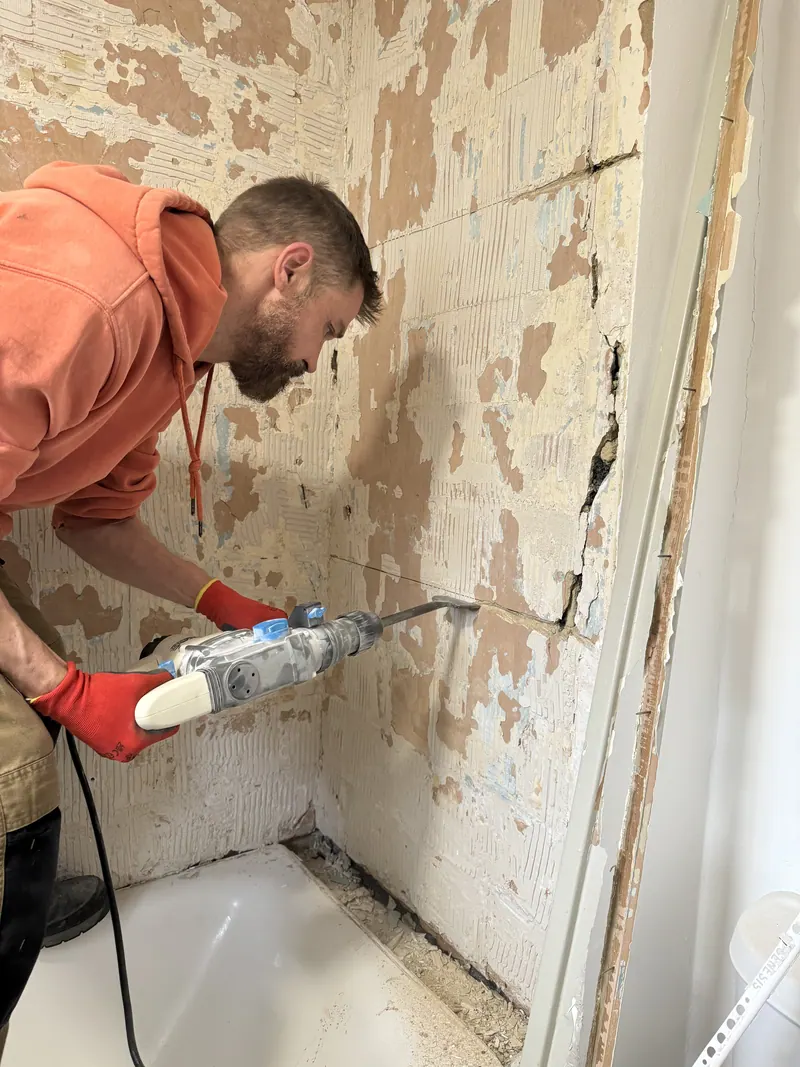 Chasing out a wall during a bathroom strip-out
